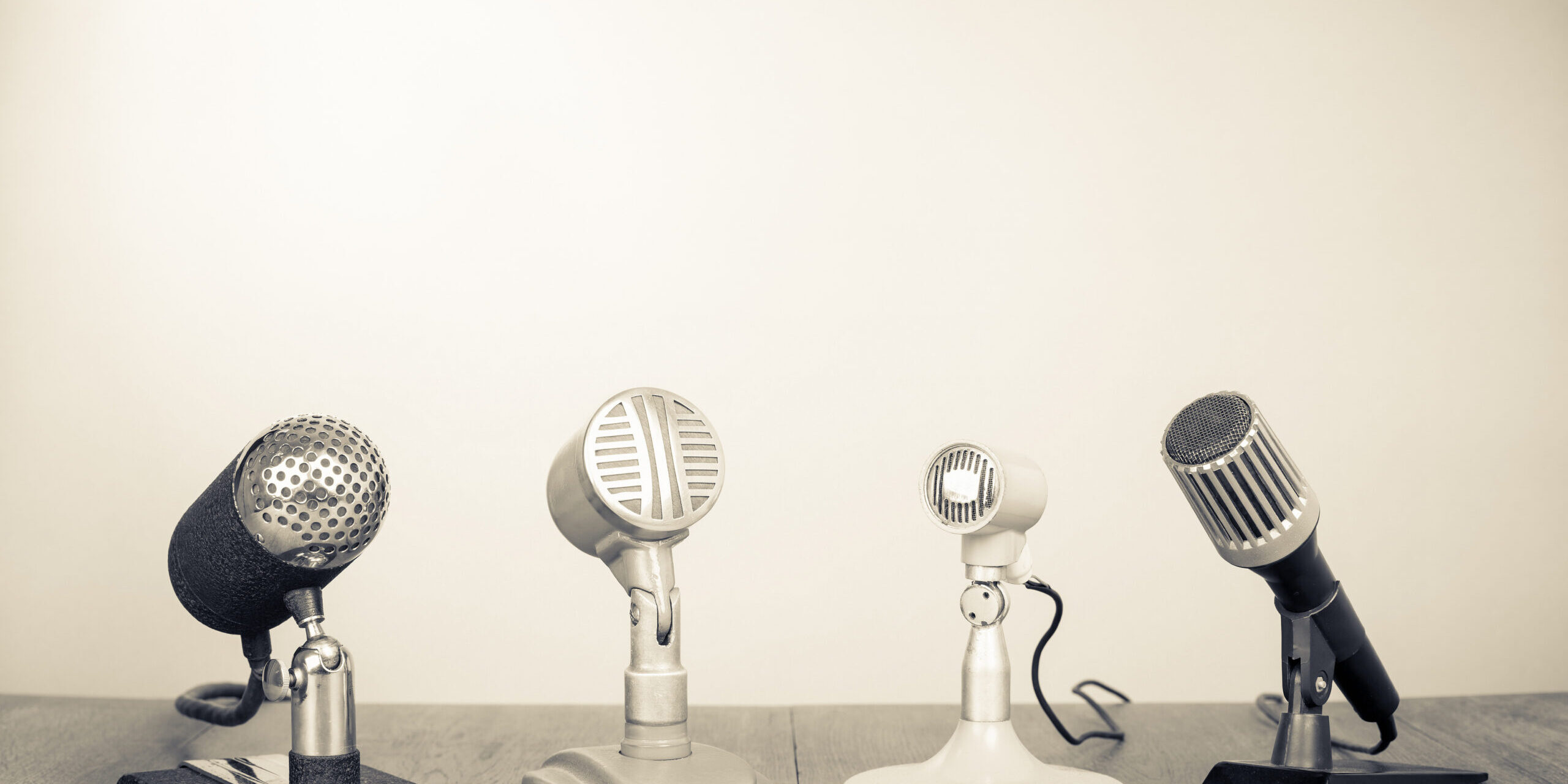 Retro,Old,Microphones,On,Table.,Vintage,Style,Sepia,Photo