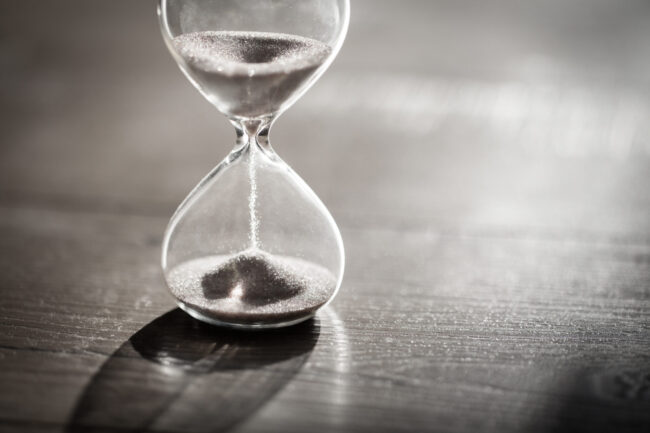 Sand,Running,Through,The,Bulbs,Of,An,Hourglass,Measuring,The
