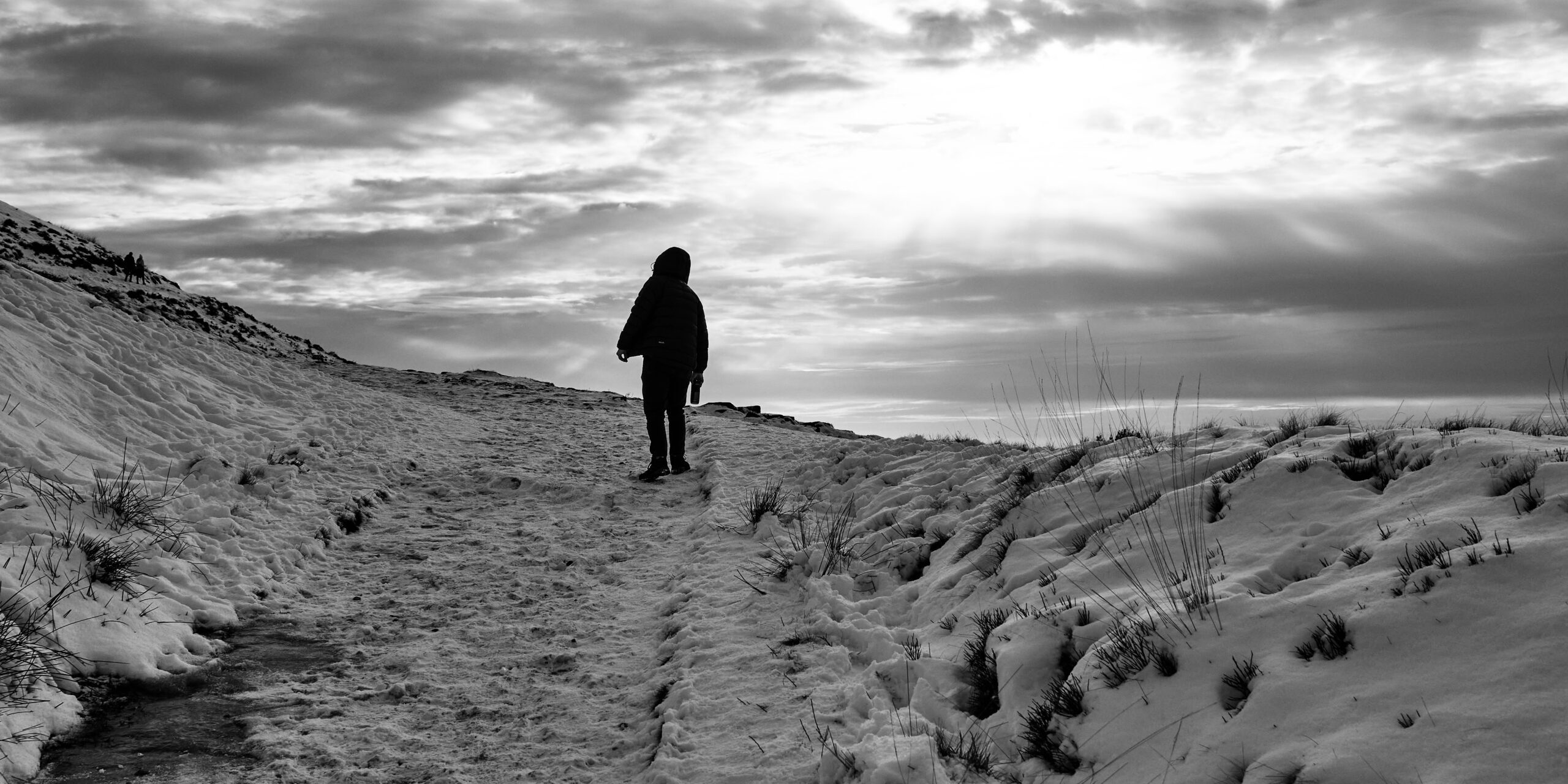 Rivington,Terraced,Gardens.person,Walking,On,A,Snow-covered,Path,Under,A